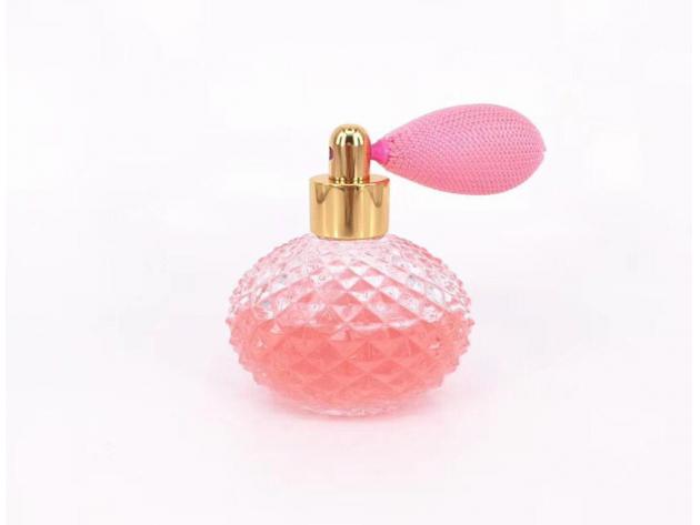 perfume pink round bottle